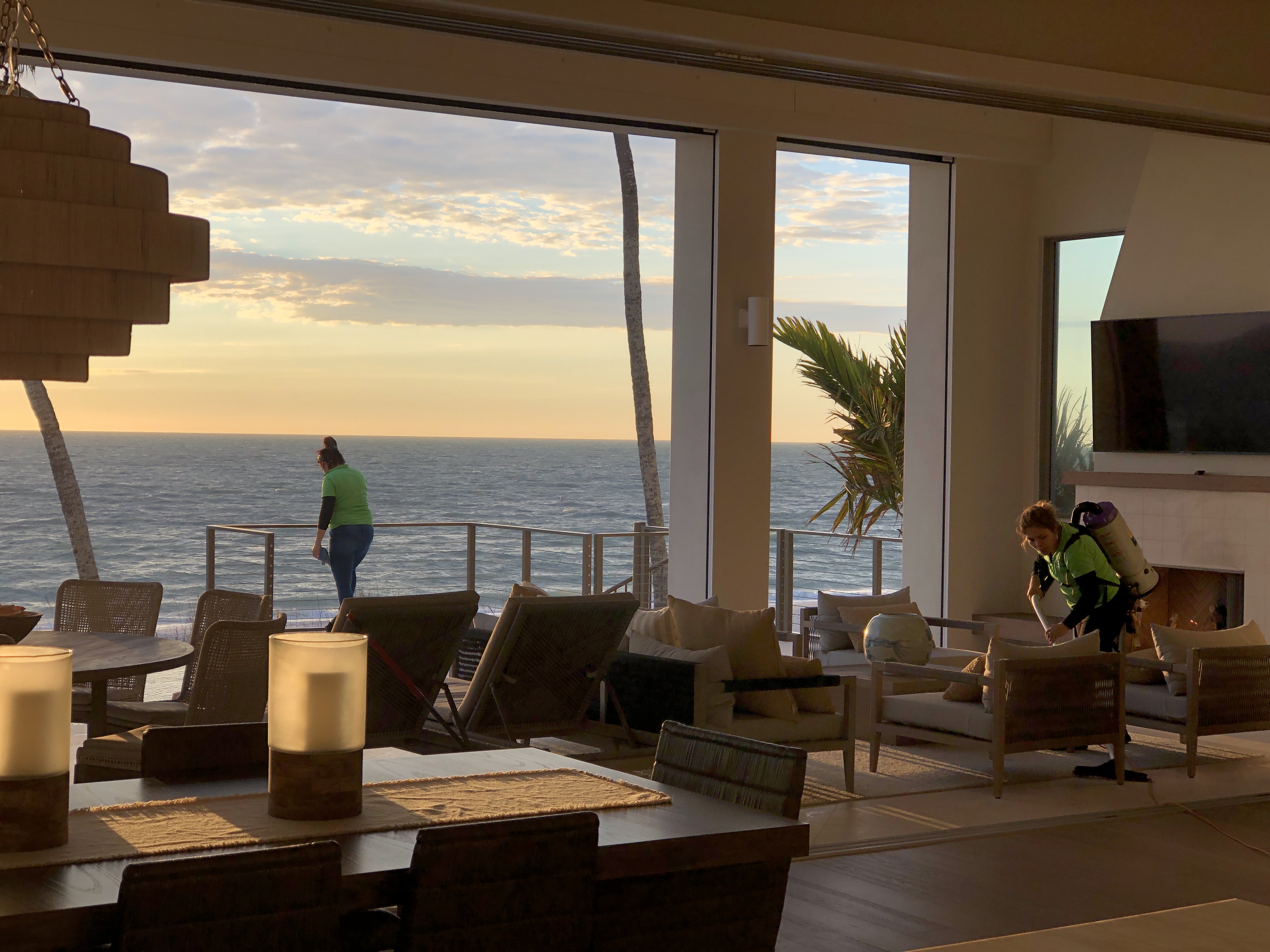 Delmy's Home Services team cleaning a beachfront home at sunset in Little Hickory, Bonita Springs FL 34134