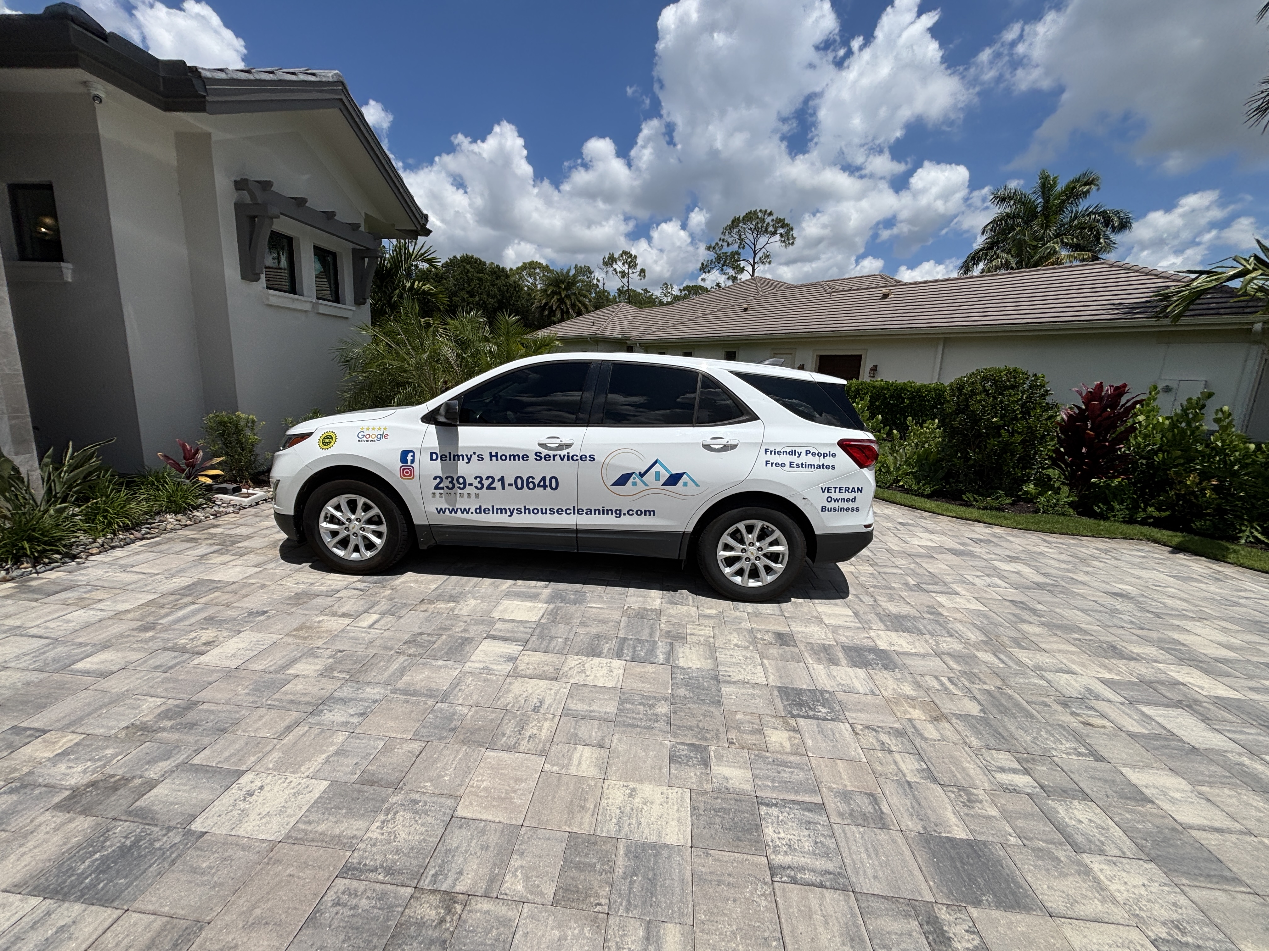Delmy's Home Services vehicle at a Quail West estate home in Naples FL 34119